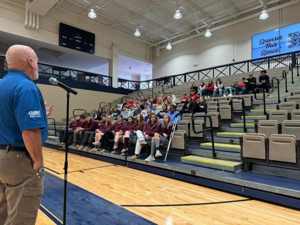 An OVAC official speaks to student members of Varsity Board at the October meeting.