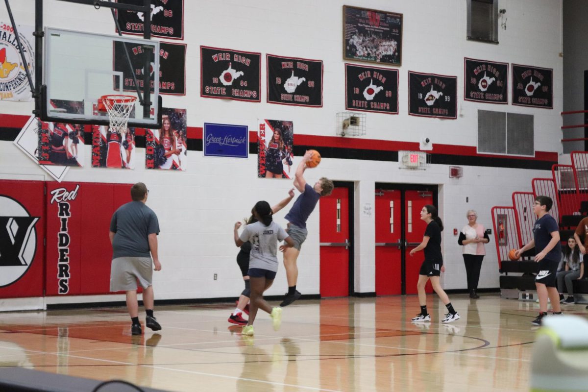 FBLAs fundraising 3v3 basketball game.