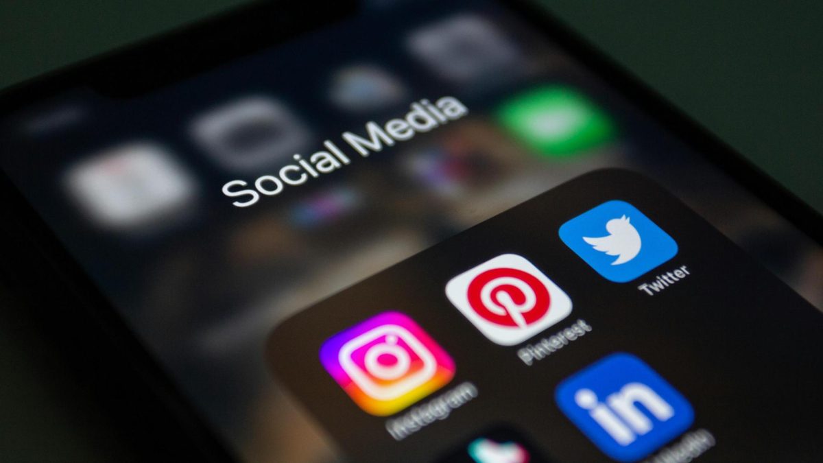 Close-up of a Smartphone Screen Displaying Social Media App Folder